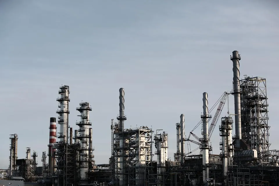 Refinery towers against the sky